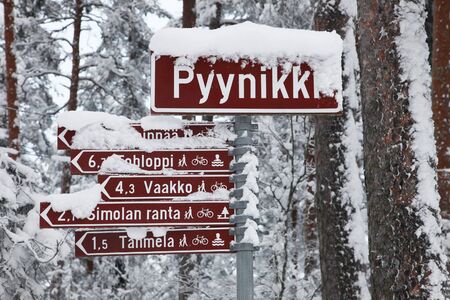 Snow-covered road signs in a park in Tampere, Finlandの写真素材
