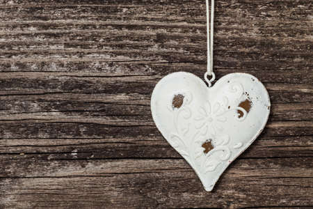 Old heart on wooden boardの写真素材