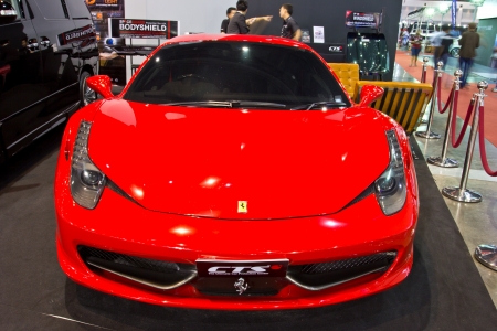 BANGKOK - JUNE 23 : RED FERRARI  show at the second Bangkok International Auto Salon 2013, the largest and most magnificent Modified Car and automobile accessories show in Bangkok, Thailand.のeditorial素材