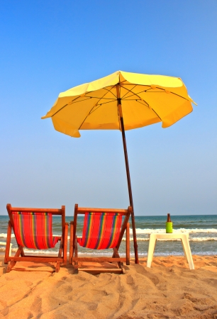 Beach chair and umbrella on tropical beach in Cha-Am ,Thailandの写真素材