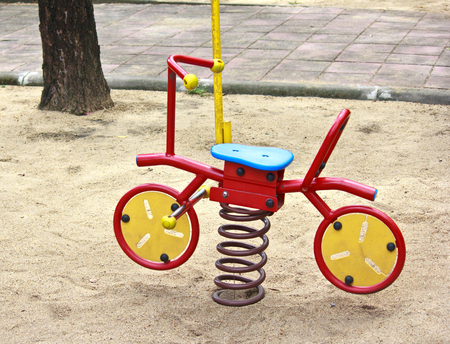 toy bicycle at a playground in Thailandの写真素材