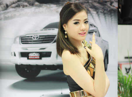BANGKOK, THAILAND - MARCH 30, 2014  Unidentified female presenter pose in the 35th Bangkok International Motor Show on March 30, 2014 in Nonthaburi, Thailand のeditorial素材