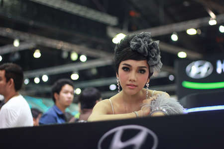 BANGKOK, THAILAND - MARCH 30, 2014  Unidentified female presenter pose in the 35th Bangkok International Motor Show on March 30, 2014 in Nonthaburi, Thailand のeditorial素材