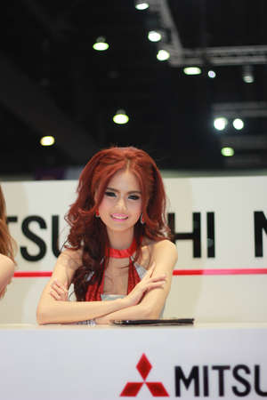 BANGKOK, THAILAND - MARCH 30, 2014  Unidentified female presenter pose in the 35th Bangkok International Motor Show on March 30, 2014 in Nonthaburi, Thailand のeditorial素材