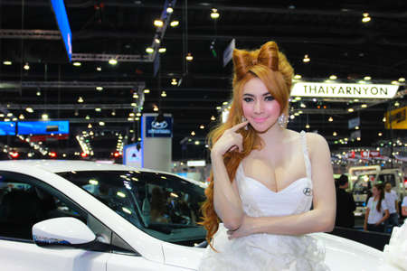 Nonthaburi, Thailand - November 29, 2014: Unidentified model  with HYUNDAI pose in the 31th  Thailand International Motor Expo on November 29, 2014 in Nonthaburi, Thailand.のeditorial素材