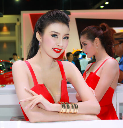 Nonthaburi, Thailand - November 29, 2014: Unidentified pretty  with MG pose in the 31th  Thailand International Motor Expo on November 29, 2014 in Nonthaburi, Thailand.のeditorial素材
