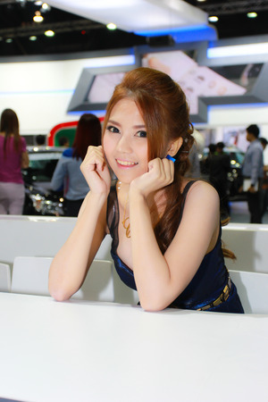 Nonthaburi, Thailand - November 29, 2014: Unidentified pretty  with Chevrolet pose in the 31th  Thailand International Motor Expo on November 29, 2014 in Nonthaburi, Thailand.のeditorial素材