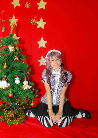 Bangkok - Dec 28: An unidentified Japanese anime cosplay pose  in COSCOM EXTRA : Christmas  on December 28, 2014 at Suan Dusit Rajabhat Univeristy, Bangkok, Thailand.のeditorial素材