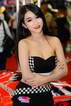 BANGKOK, THAILAND - JULY 08, 2018: Unidentified female presenter pose in the Bangkok International Auto Salon on July 08, 2018 in Bangkok, Thailand.のeditorial素材