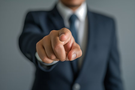 Businessman pointing finger to the camera. Close up of businessman in suit pointing finger to camera. generative aiの素材