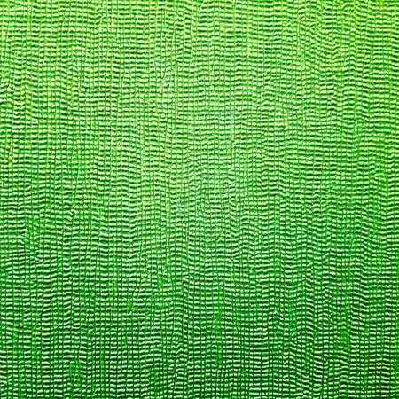 Green ceramic tile with abstract pattern for wall and floor decoration. Concrete stone surface background. Green texture with for interior design project.の写真素材