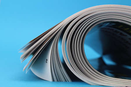 Open magazines with a blue backgroundの写真素材