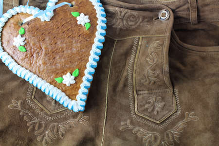 Bavarian lederhosen with a gingerbread heartの写真素材