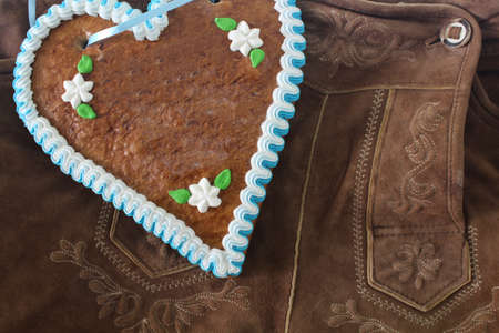 Bavarian lederhosen with a gingerbread heartの写真素材