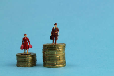 different figures of people stand on euro coinsの写真素材
