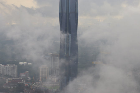 high buildings surrounded by cloudsの写真素材