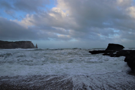 Dramatic stormy sky over the cliffs of Etretatの写真素材