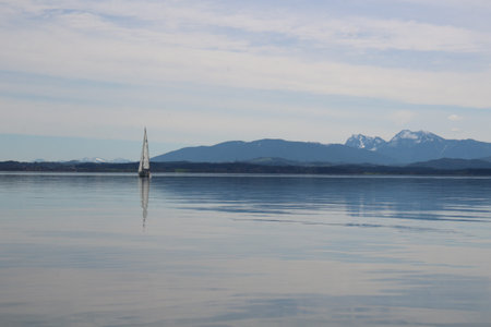 Sailboat in the fjord in norway. There are mountains in the background.の写真素材
