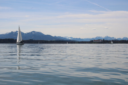 Sailboat on the lake with mountains in the background, Austriaの写真素材