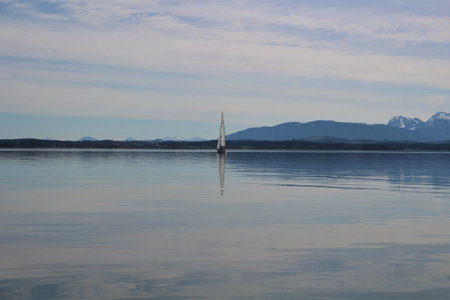 Sailboat on the calm water of the fjord.の写真素材
