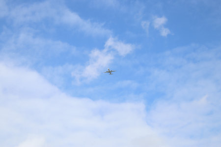 Airplane flying in the blue skybe used as background