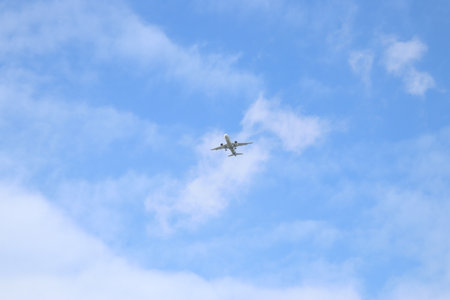 airplane in the blue sky, closeup of photo with soft focusの写真素材