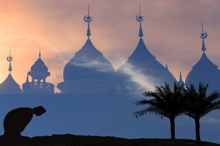 Silhouettes Muslim prayer,the light of faith, hope, faith, supplication,Muslim boy praying faith in Allah God of Islam supremelyの写真素材