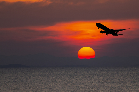 airplane taking off airport sky-diving industry cargo business, concept: passenger Commercial  modern navigable Travel and business,Silhouette aircraft is flying above skyline sunの写真素材
