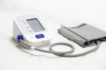 Woman checking accuracy blood pressure monitor,concept:Health care and Medical,Doctor Measuring  patient arterialの写真素材