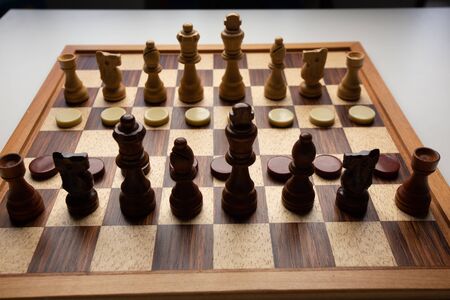 Chess placed on a wooden table,concept : of business strategy and tactic battle,symbol competition...