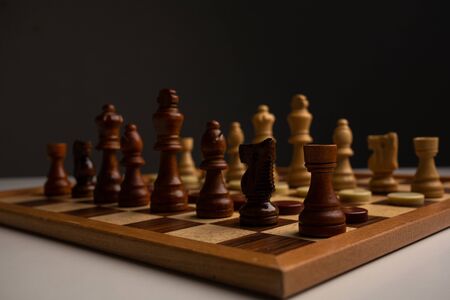 Chess placed on a wooden table,concept : of business strategy and tactic battle,symbol competition...