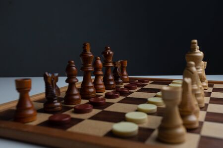 Chess placed on a wooden table,concept : of business strategy and tactic battle,symbol competition...