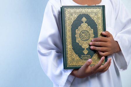 Quran - holy book of Muslims religion, Concept: open book holy prayers for god,Friday In the month of Ramadan  religion Islamic worshiping faith and learn koran and rosary put on wooden  boardsの写真素材