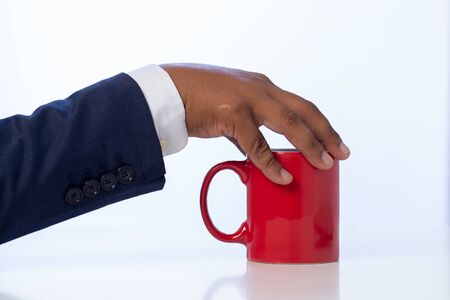 Businessman holding a coffee cup on the white table at the office
Concept: planning meeting working professional,beverage cafe breakfast for working, looking space to a morning lifestyleÂ workplaceの写真素材