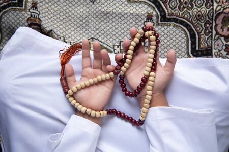 praying hands Muslim men pray to worship with faith during the Ramadan,
concept: spirituality religion for hope to create inspiration for living happiness,
 meditation praise god for  forgivenessの写真素材