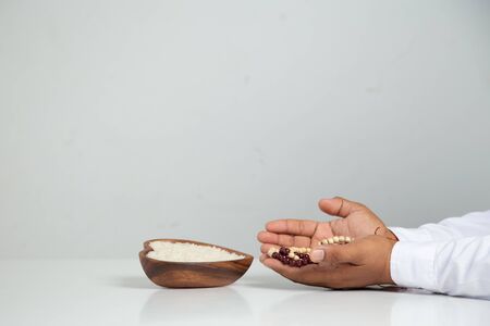ZAKAT donation for Muslim according to religious principles during the Ramadan month,concept:praying hands Muslim men pray to worship with faithの写真素材