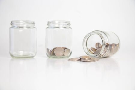 child's hand holding a coin in a glass bottle,Concept: saving  coin family money for home dreams,symbol growing  investment success wealth to  benefit,
business growth  banking for  cash
の写真素材