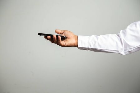 businessman working with smartphone modern devices communication technology for payments online,
Concept: work at home, abstract digital devices detox
 entrepreneur connection success professionalの写真素材