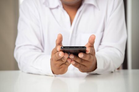 businessman working with smartphone modern devices communication technology for payments online,
Concept: work at home, abstract digital devices detox
 entrepreneur connection success professionalの写真素材