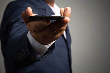 businessman working with smartphone modern devices communication technology for payments online,
Concept: work at home, abstract digital devices detox
 entrepreneur connection success professionalの写真素材