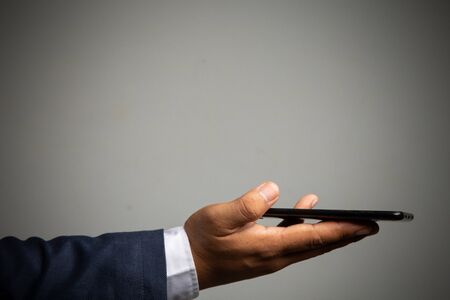 businessman working with smartphone modern devices communication technology for payments online,
Concept: work at home, abstract digital devices detox
 entrepreneur connection success professionalの写真素材