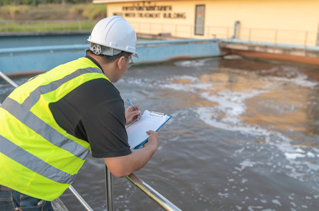 Environmental engineers work at wastewater treatment plants,Water supply engineering working at Water recycling plant for reuseの写真素材