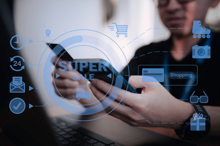 Hand of asian man holding smartphone with credit card,Pay for various bills that use a credit cardの写真素材