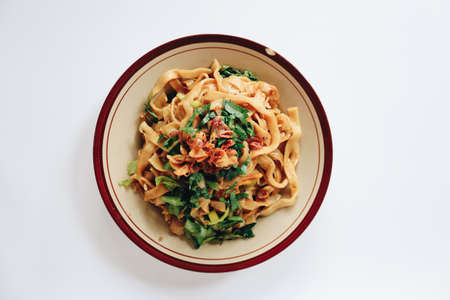 Stir fried flat noodle and pork with dark soy sauce. Indonesia said called Bakmie Jowo or Fried...