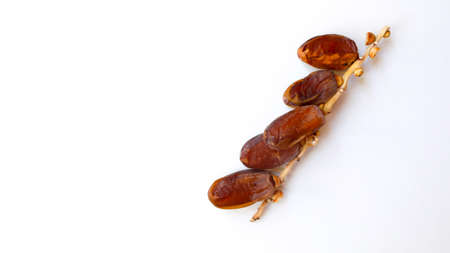 Dates fruit isolated on a white background. Top view. Flat lay pattern.の写真素材