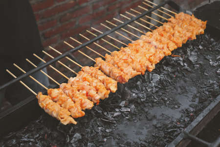 Chicken Satay or Chicken skin satay is grilled chicken skewers marinated with spices and red chili sauceの写真素材