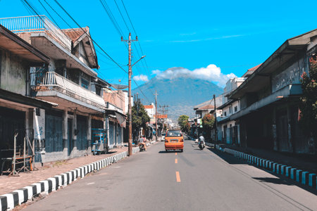 View of small town with Sindoro Mountain background in Parakan, Temanggung, Indonesia. Temanggung, Indonesia - December, 2020.のeditorial素材