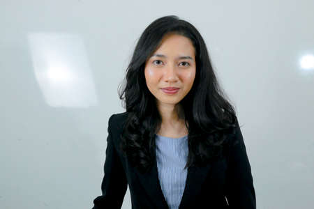 Business young asian girl is happy and confidence look.