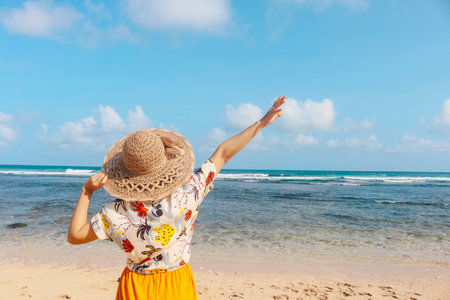 Portrait of happy smiling Asian woman enjoys a holiday at the beach.の写真素材