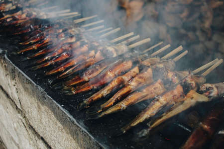 Cat fish barbecue grilled on hot charcoal stove in traditional way in Yogyakarta, Indonesia or normally called Mangut lele.の写真素材